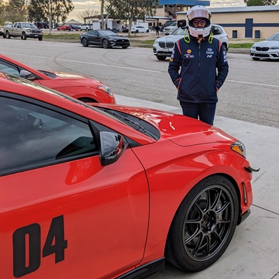 Profile Picture of Adrián Moreno (@zetxek), working side by side with a colleague: sitting on a desk, while looking at a screen